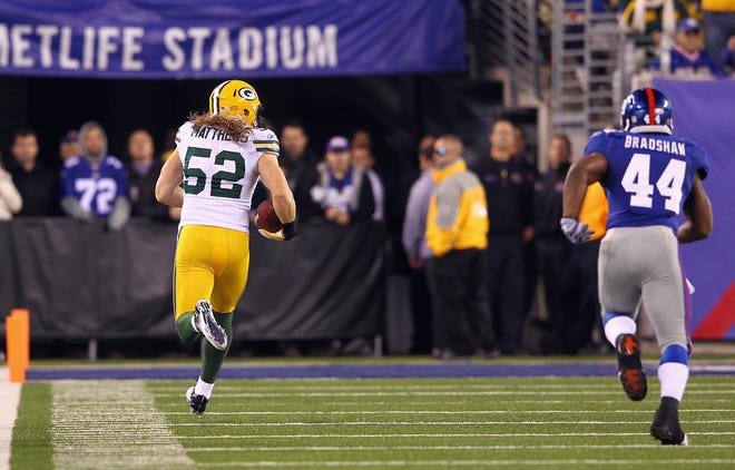 Clay Matthews (52) of the Green Bay Packers returns an interception 38-yards for a touchdown during the second quarter against the New York Giants at MetLife Stadium on December 4, 2011 in East Rutherford, New Jersey.
