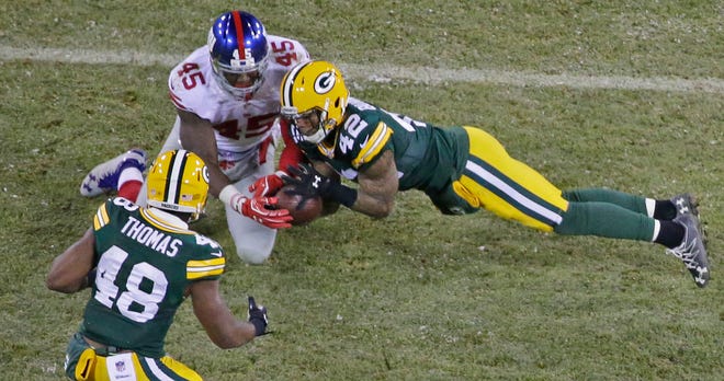 Green Bay Packers strong safety Morgan Burnett (42) breaks up a pass intended for New York Giants tight end Will Tye (45) during the 3rd quarter of the Green Bay Packers wild-card playoff game against the New York Giants at Lambeau Field in Green Bay, Wis. on Sunday, January 8, 2017. The Packers won 38-13.