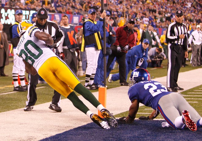 Donald Driver gets both of his feet down for a touchdown reception late in the 4th quarter as Corey Webster covers. The score gave the Packers an 8 point lead and the Green Bay Packers defeated the New York Giants 38-35 at MetLife Stadium in East Rutherford N.J. Sunday December 4, 2011.