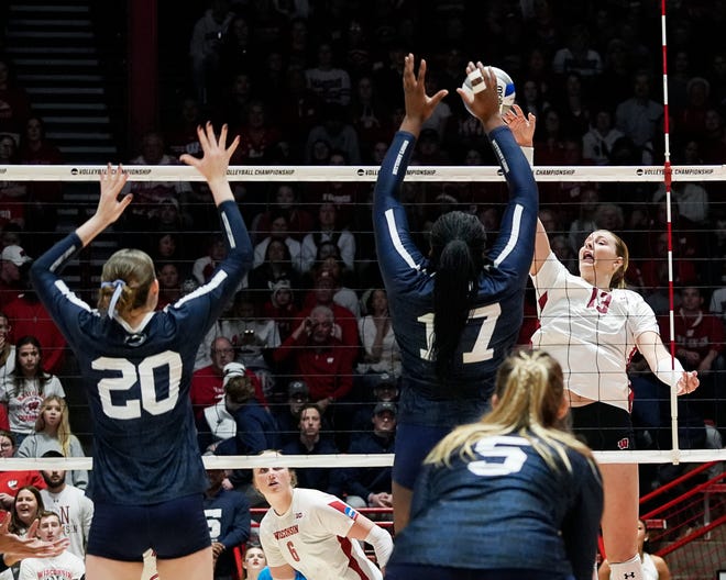 Penn State outside hitter Zoe Weatherington (17) attempts to block the shot from Wisconsin outside hitter Sarah Franklin (13) during the second set of the NCAA Regional Volleyball semifinal match on Thursday December 7, 2023 at the UW Field House in Madison, Wis.