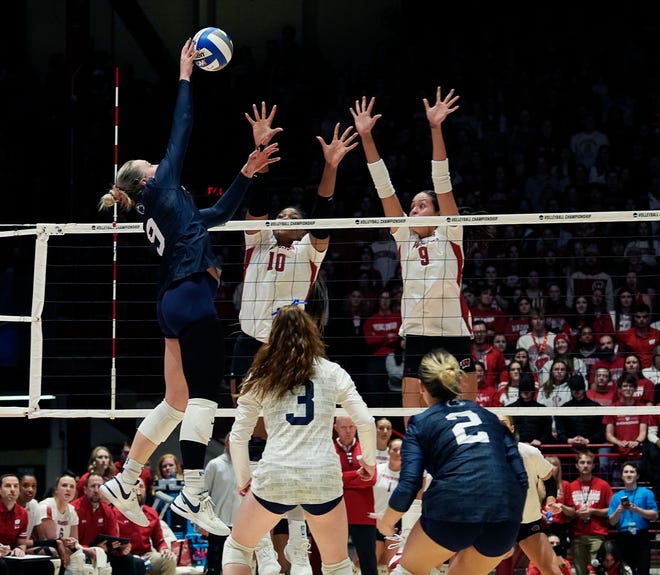 Wisconsin opposite Devyn Robinson (10) and middle blocker Caroline Crawford (9) attempt to block the shot from Penn State outside hitter Jess Mruzik (9) during the second set of the NCAA Regional Volleyball semifinal match on Thursday December 7, 2023 at the UW Field House in Madison, Wis.